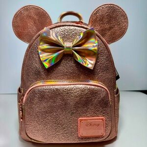 NWT. Loungefly Disney Minnie Mouse backpack. Metallic pink iridescent color